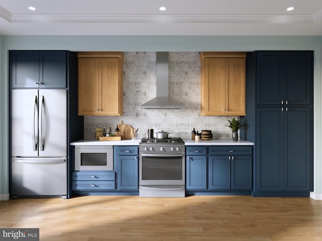 kitchen featuring backsplash, blue cabinetry, wall chimney exhaust hood, and stainless steel appliances