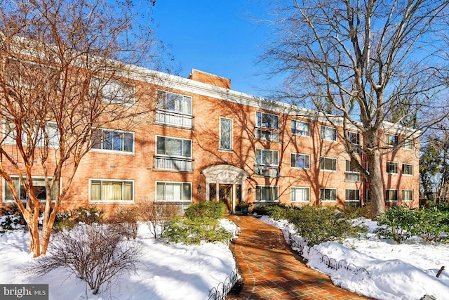 view of snow covered property