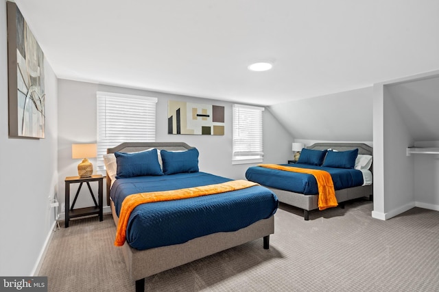 bedroom featuring carpet and lofted ceiling