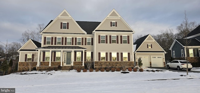 craftsman-style home featuring a porch and a garage