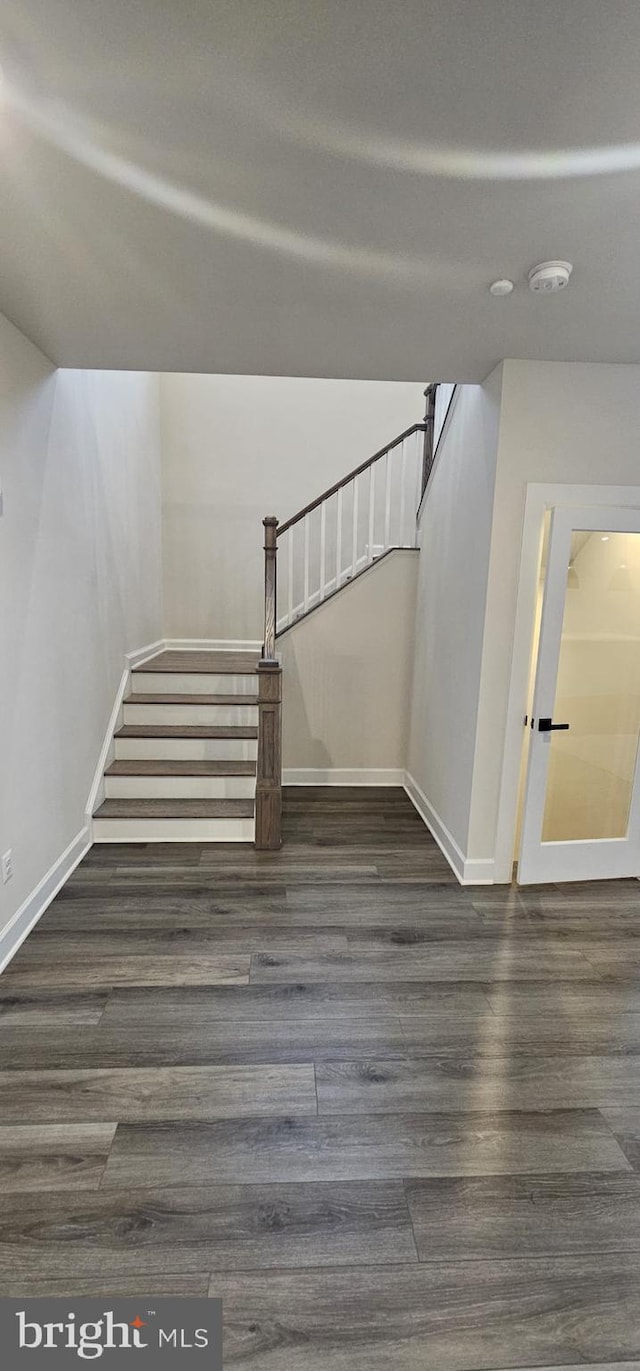 stairway featuring hardwood / wood-style flooring