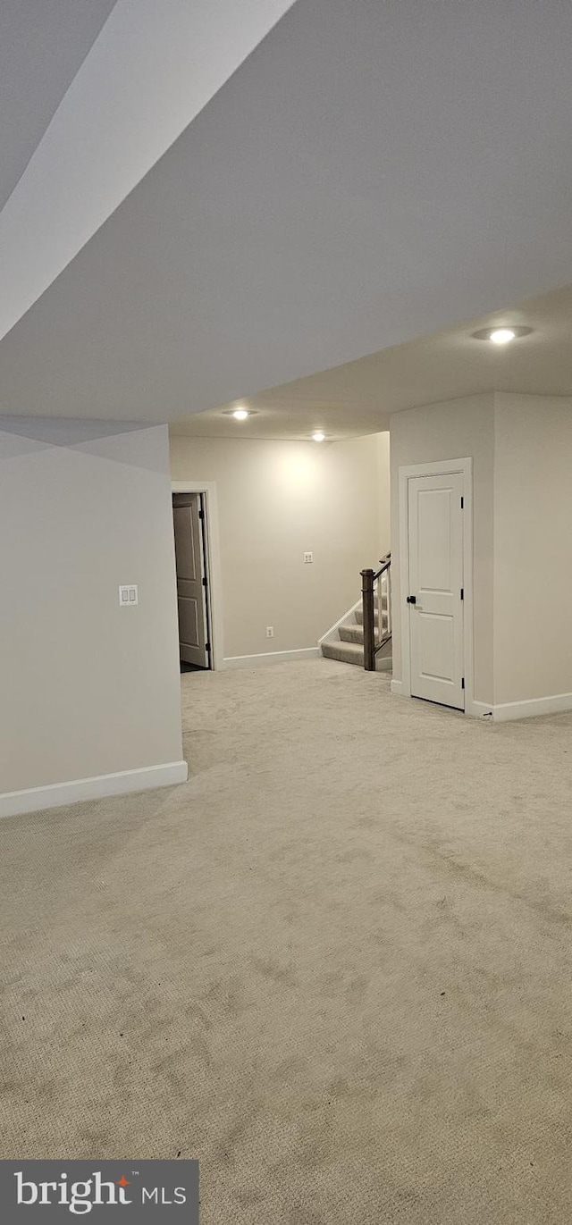 basement with light colored carpet