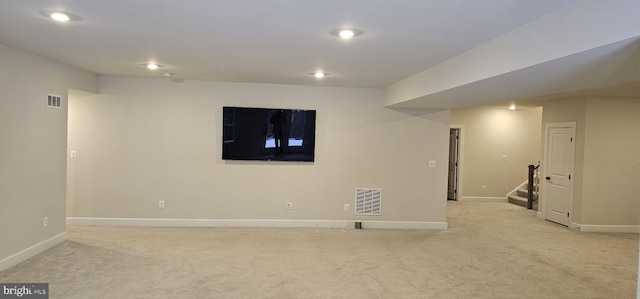 basement with light colored carpet