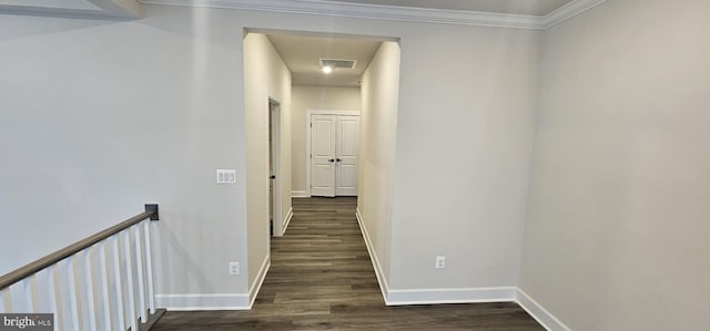 hall featuring ornamental molding and dark hardwood / wood-style floors