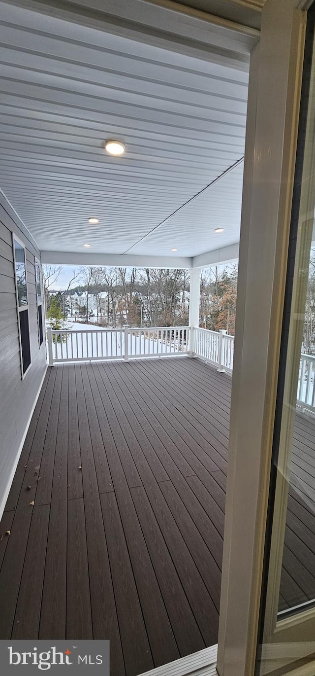 view of snow covered deck