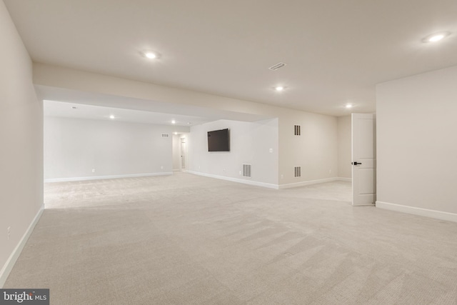 interior space featuring light colored carpet