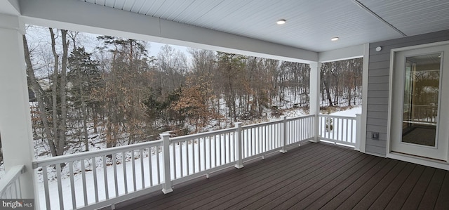 view of snow covered deck