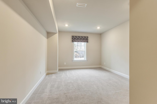 empty room with light colored carpet