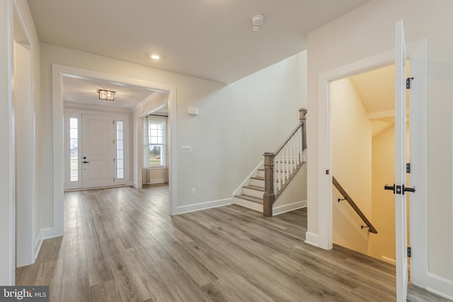 entryway with hardwood / wood-style flooring