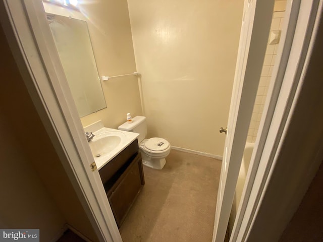 bathroom featuring vanity, toilet, and walk in shower