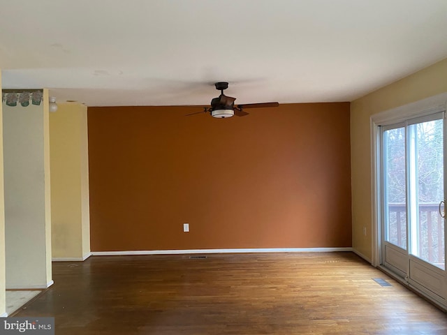 spare room featuring hardwood / wood-style flooring and ceiling fan