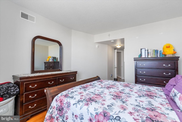 bedroom with light wood-type flooring