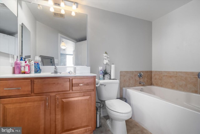 bathroom with toilet, vanity, a bath, and tile patterned flooring