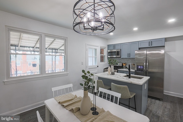 dining area featuring recessed lighting, baseboards, and dark wood-style flooring