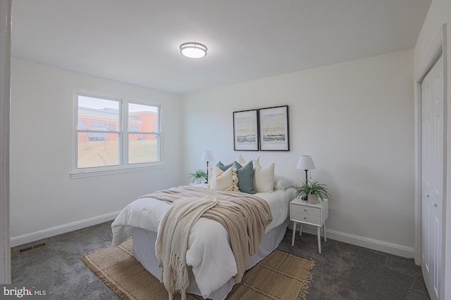 carpeted bedroom featuring visible vents and baseboards