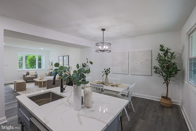 dining room with recessed lighting, an inviting chandelier, baseboards, and dark wood-style flooring