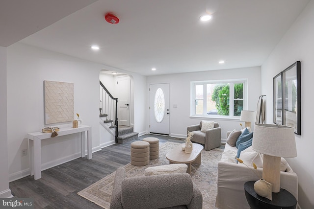 entrance foyer with recessed lighting, baseboards, wood finished floors, and stairs