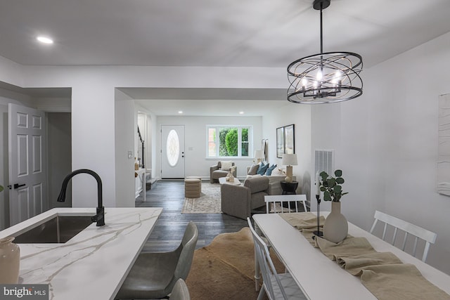 dining space with recessed lighting, baseboards, and dark wood-style flooring