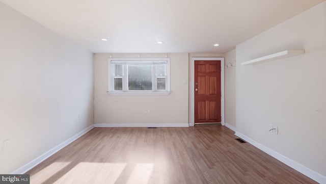 unfurnished room featuring light hardwood / wood-style flooring