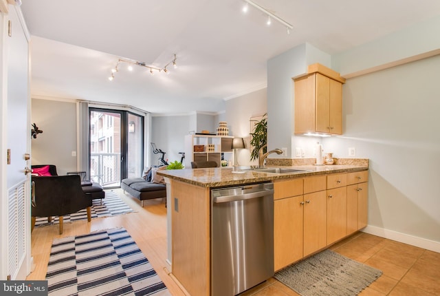 kitchen featuring dishwasher, light brown cabinets, kitchen peninsula, and sink