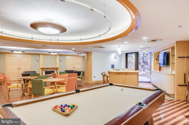 rec room featuring a tray ceiling and billiards