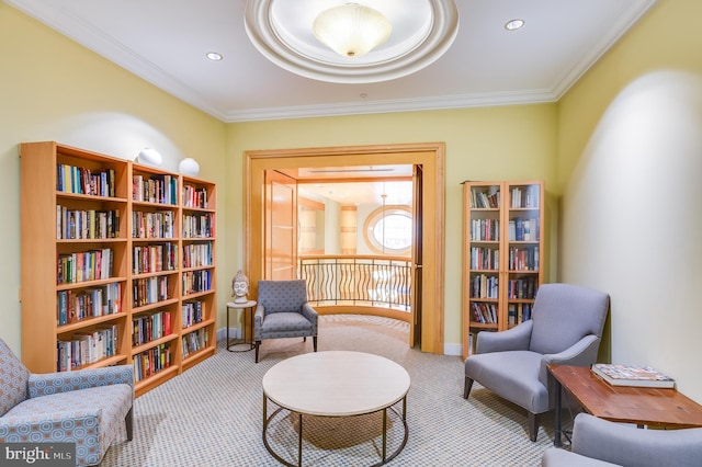 sitting room with light carpet and crown molding