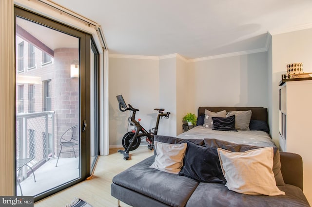 bedroom featuring access to outside, crown molding, and light hardwood / wood-style flooring