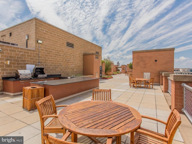 view of patio / terrace featuring exterior kitchen and grilling area