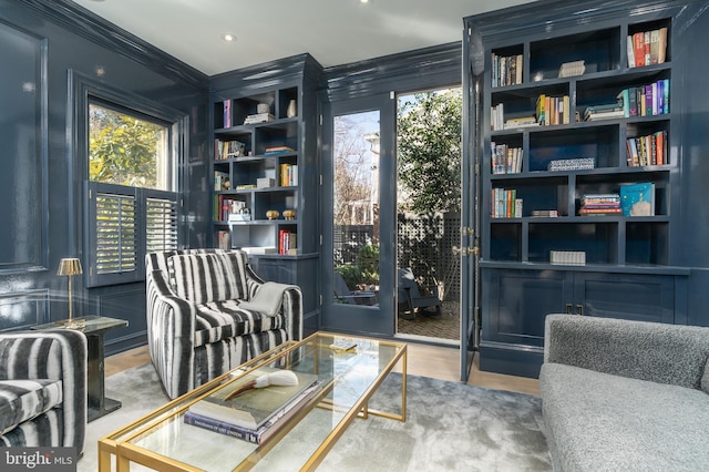 living area with recessed lighting and wood finished floors