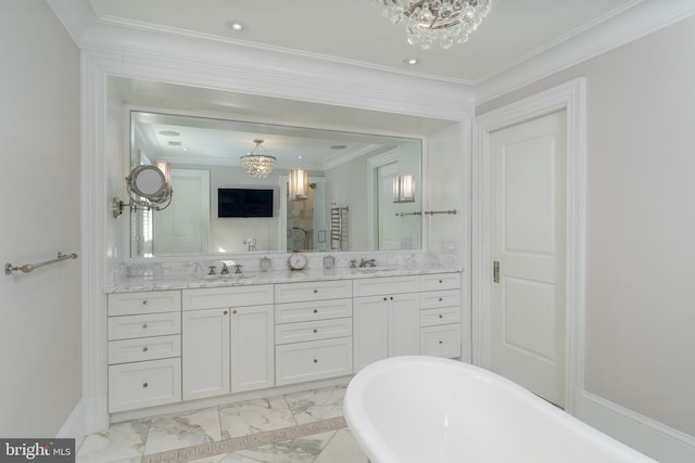 bathroom with an inviting chandelier, a stall shower, marble finish floor, and a sink