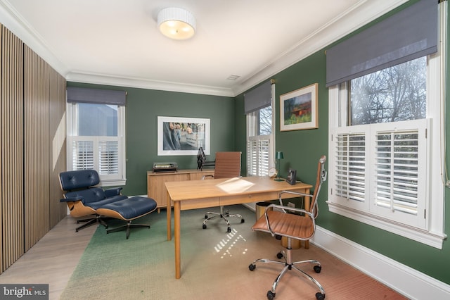 office space with crown molding, baseboards, and wood finished floors