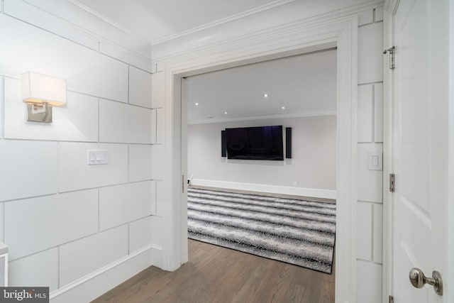 interior space featuring wood finished floors and ornamental molding