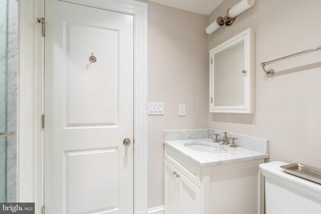 bathroom with toilet and vanity