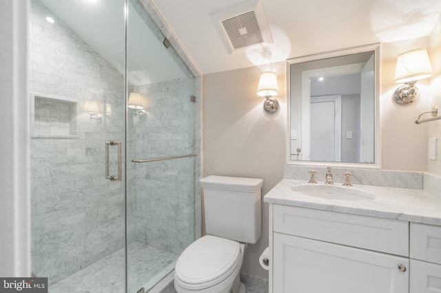 bathroom featuring visible vents, a stall shower, toilet, and vaulted ceiling