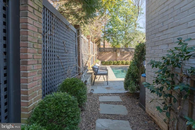 view of yard featuring a fenced in pool, fence private yard, and a patio