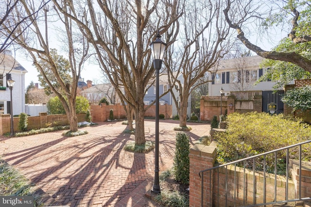 surrounding community featuring a residential view and fence