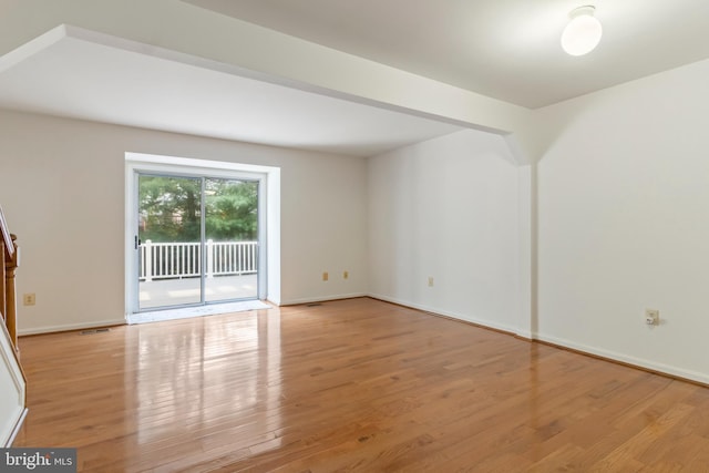 spare room with light wood-type flooring