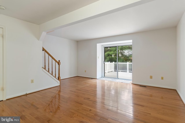 unfurnished living room with light hardwood / wood-style flooring