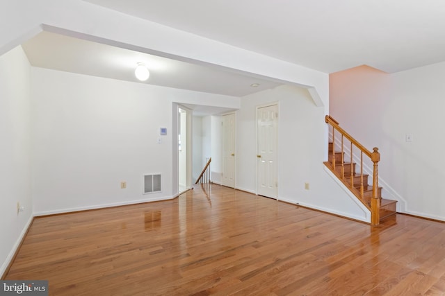 spare room with light hardwood / wood-style flooring