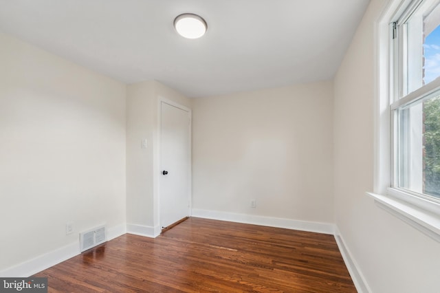 empty room featuring dark hardwood / wood-style floors