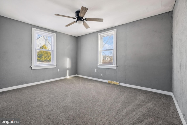 carpeted empty room with ceiling fan