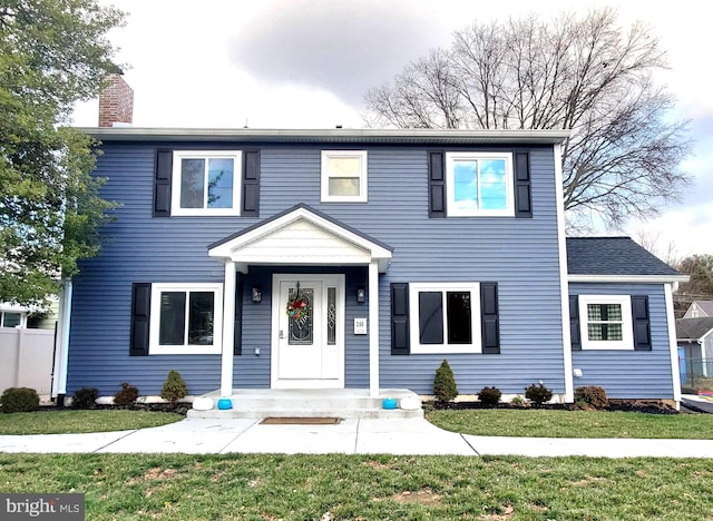 view of front of home with a front lawn