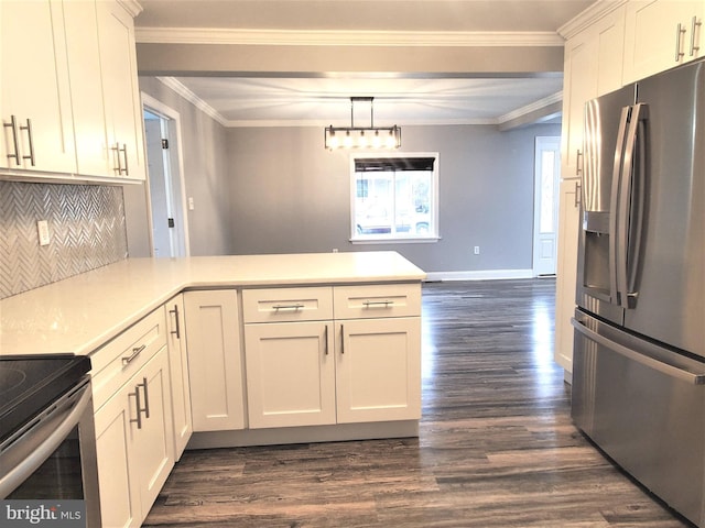 kitchen with white cabinetry, stainless steel fridge, hanging light fixtures, ornamental molding, and kitchen peninsula