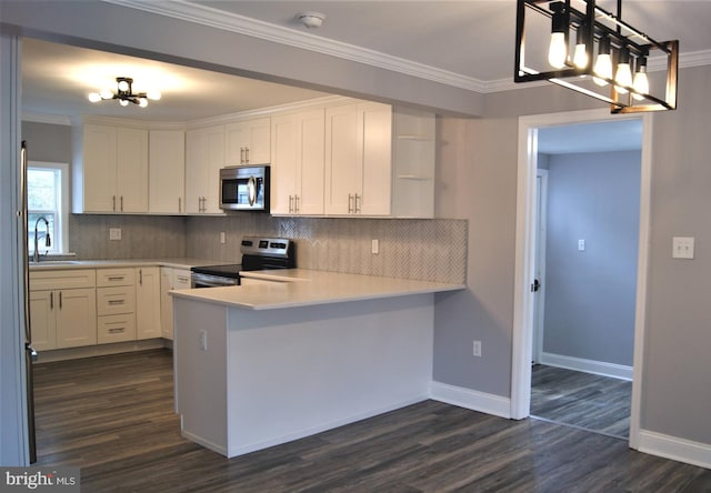 kitchen with white cabinetry, crown molding, decorative light fixtures, appliances with stainless steel finishes, and kitchen peninsula