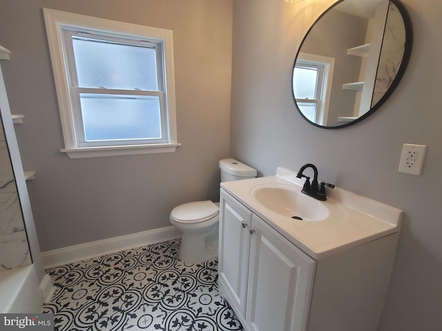 bathroom featuring tile patterned flooring, vanity, and toilet