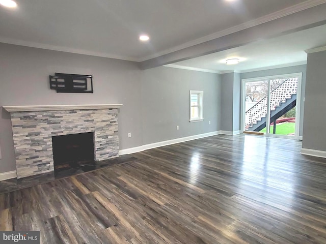 unfurnished living room with crown molding, dark wood-type flooring, and a fireplace