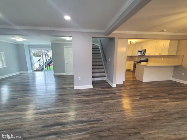 unfurnished living room featuring crown molding and dark wood-type flooring