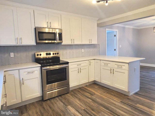 kitchen featuring stainless steel appliances, white cabinetry, ornamental molding, and kitchen peninsula