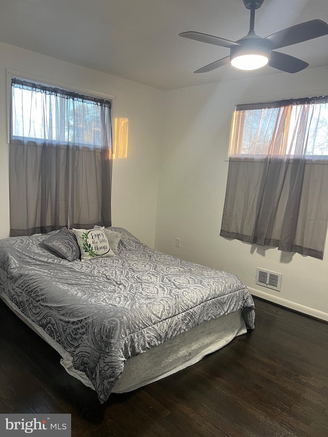 bedroom with hardwood / wood-style flooring and ceiling fan