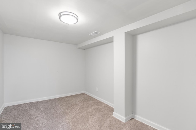 basement with light colored carpet